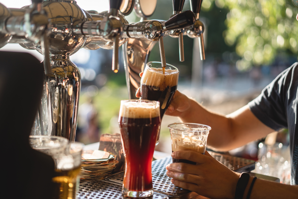 bartender-pouring-draft-beer-into-the-glasses