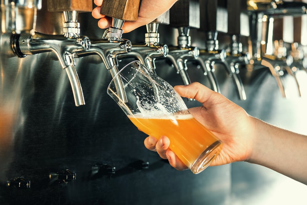 Bartender-pours-a-Draft-beer-or-Draught-Beer-at-the-bar