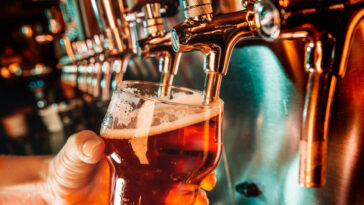 bartender-pours-draft-beer-into-the-glass